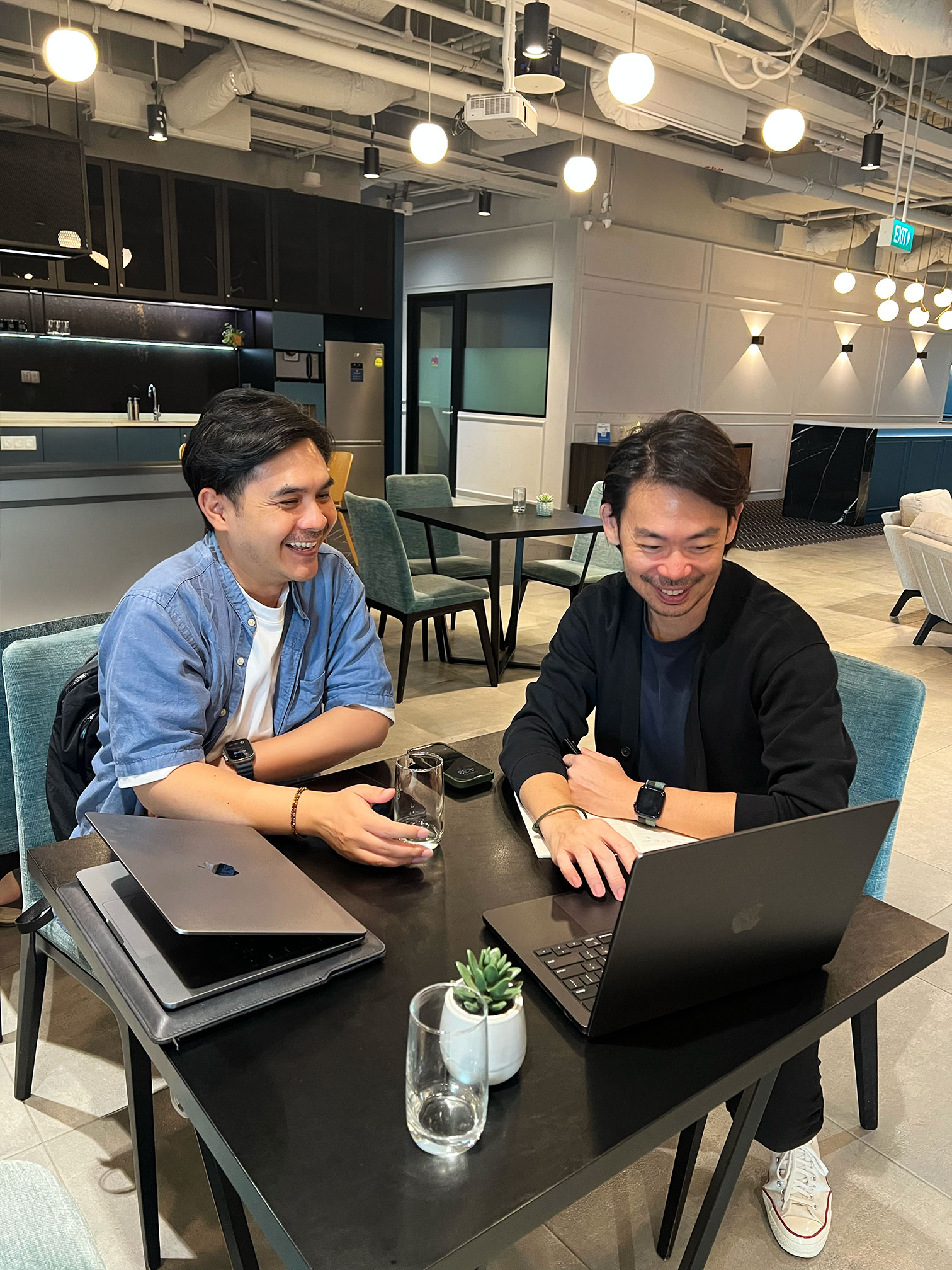 Au-Rin, founder of SMBee, working with business partner Gerald Ang